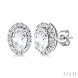 5x3 MM Oval Shape White Topaz and 1/8 Ctw Round Cut Diamond Halo Semi-Precious Stud Earrings in 14K White Gold