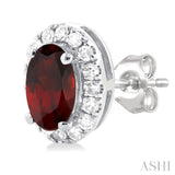 5x3 MM Oval Shape Garnet and 1/8 Ctw Round Cut Diamond Halo Semi-Precious Stud Earrings in 14K White Gold