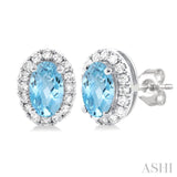 5x3 MM Oval Shape Aquamarine and 1/8 Ctw Round Cut Diamond Halo Semi-Precious Stud Earrings in 10K White Gold