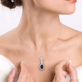 6x4 MM Oval Cut Sapphire and 1/10 Ctw Round Cut Diamond Pendant in 14K White Gold with Chain