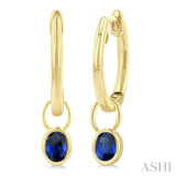 5x3 MM Bezel Set Oval Cut Sapphire Precious Fashion Huggie Earrings in 14K Yellow Gold