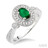 6x4mm Oval Cut Emerald and 1/5 Ctw Round Cut Diamond Ring in 14K White Gold
