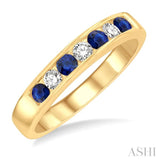 1/5 Ctw Channel Set Round Cut Diamond and 2.5 MM Round Cut Sapphire Band in 14K Yellow Gold