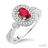 6x4mm Oval Cut Ruby and 1/5 Ctw Round Cut Diamond Ring in 14K White Gold
