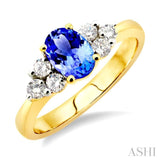7x5mm Oval Cut Tanzanite and 1/3 Ctw Round Cut Diamond Ring in 14K Yellow Gold