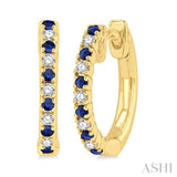 1/10 ctw Petite 1.35MM Sapphire and Round Cut Diamond Precious Fashion Huggies in 10K Yellow Gold